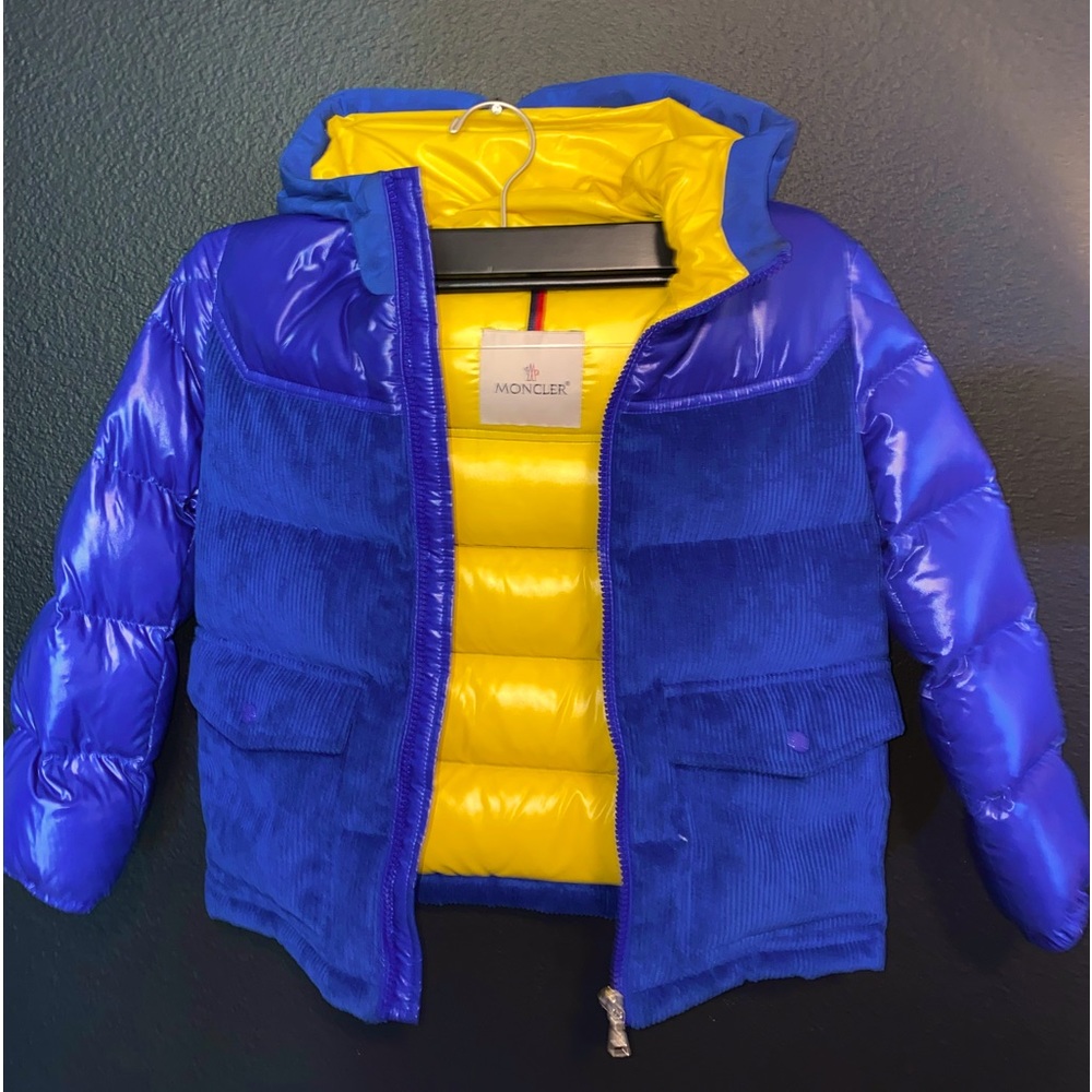 Blue childrens Moncler puffer jacket corduroy details and yellow lining.